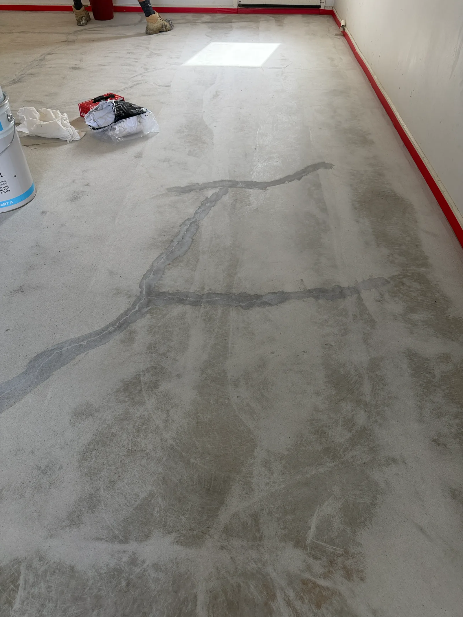 Concrete floor with structural cracks awaiting epoxy resin repair, Perth