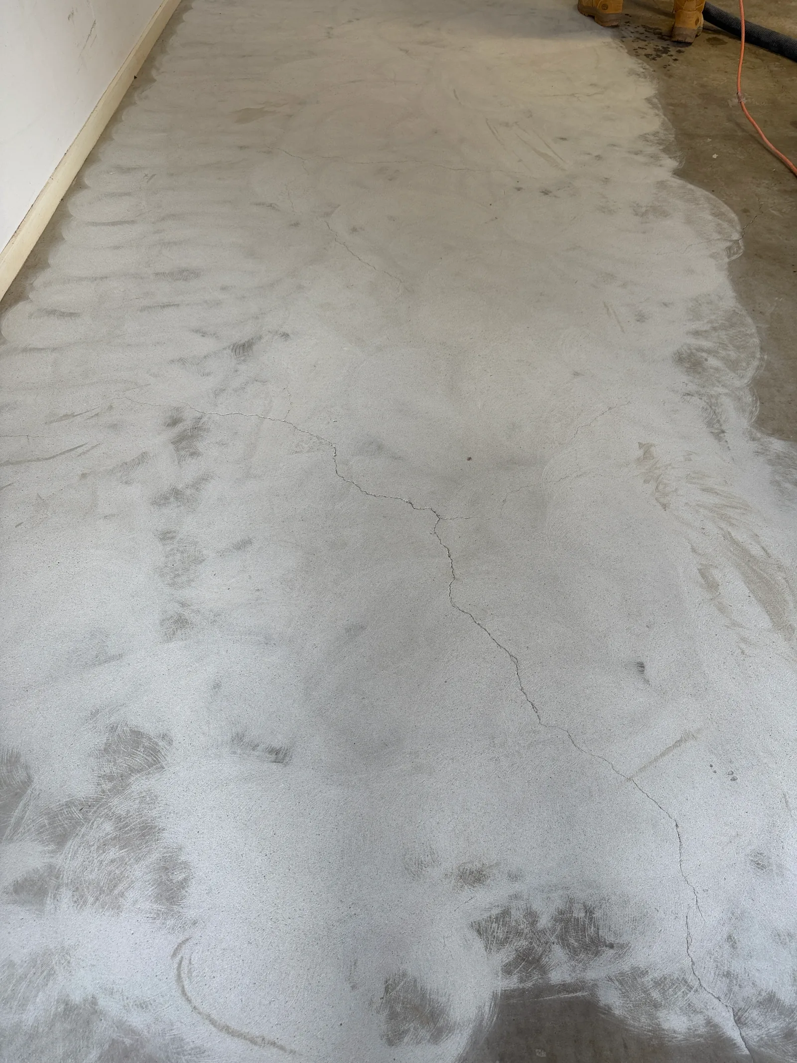 Bare cracked concrete slab before epoxy preparation, Perth garage